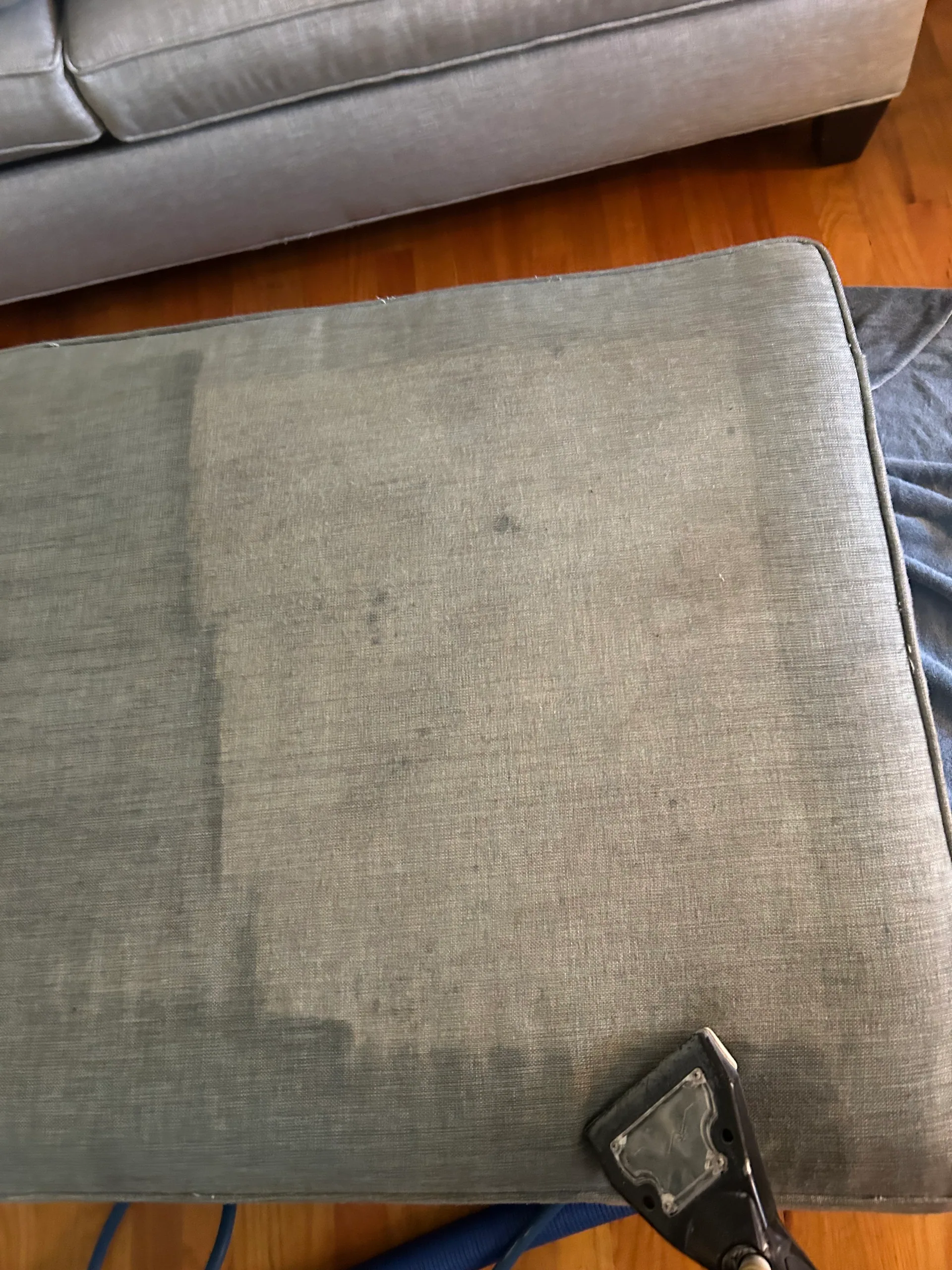 blue gray linen ottoman cushion half cleaned upholstery tool