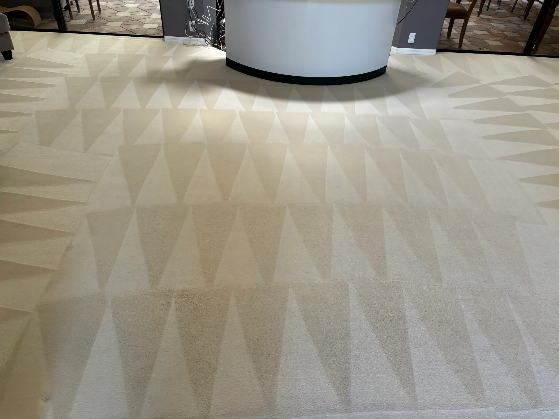 cream carpet triangle wand marks curved reception desk