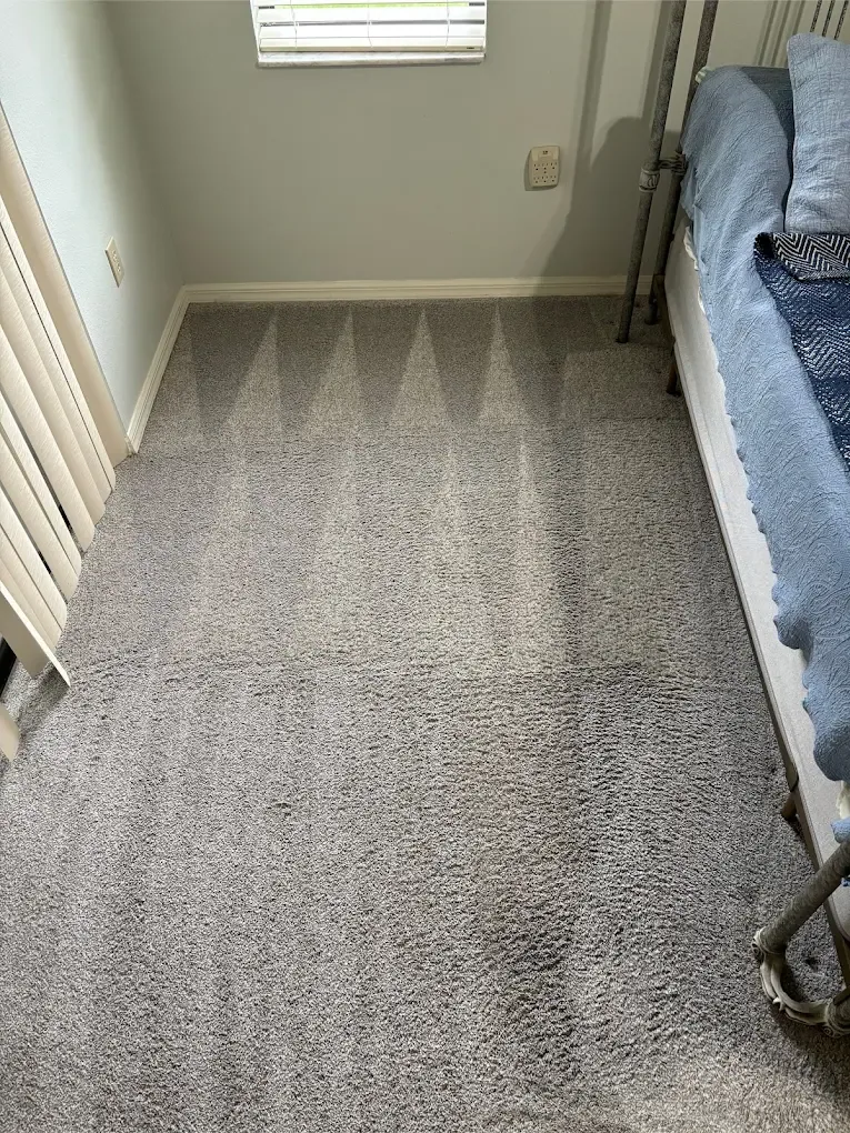 gray bedroom carpet triangle wand marks iron bed blue quilt