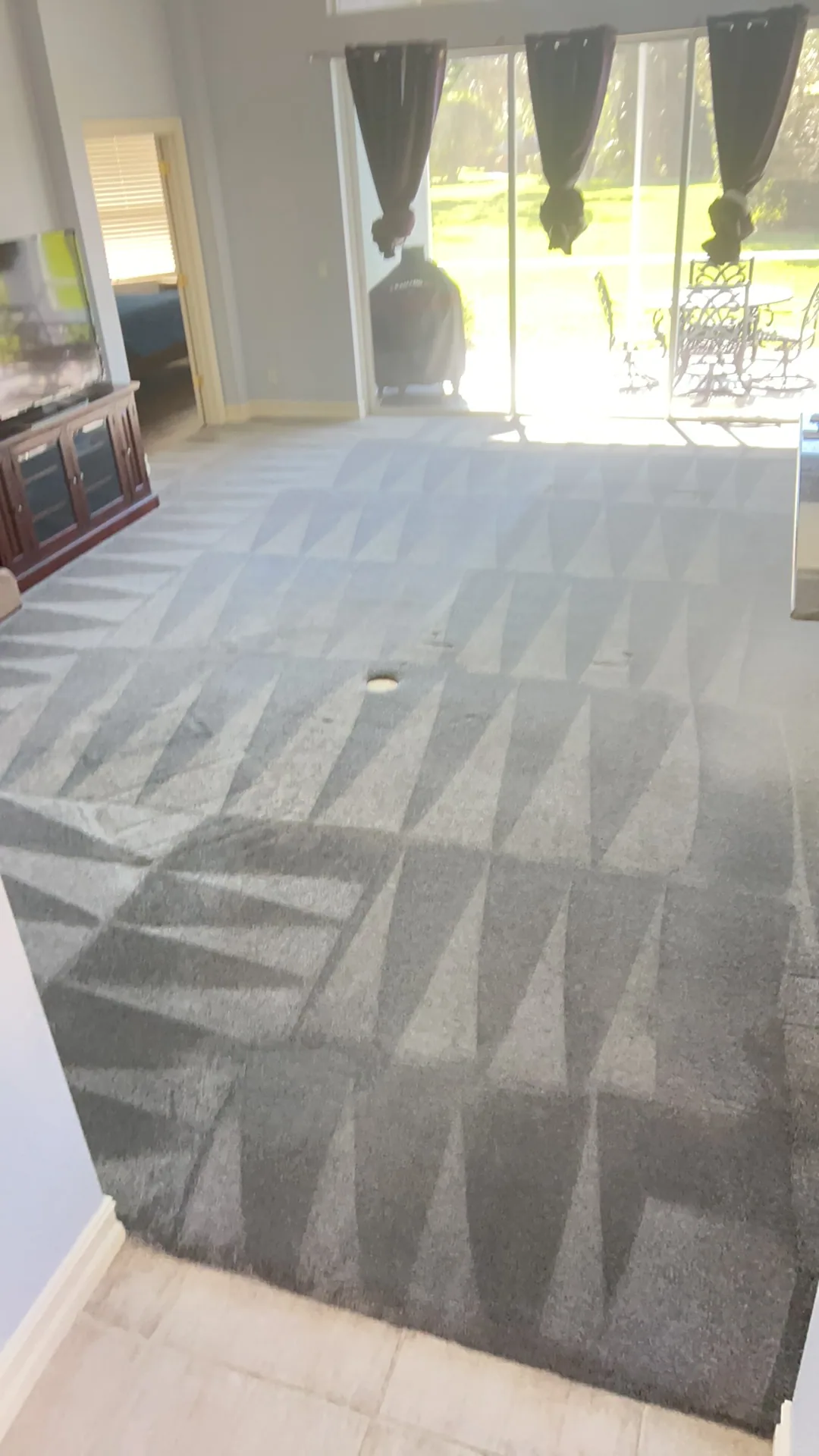 gray living room carpet triangle wand strokes sliding glass