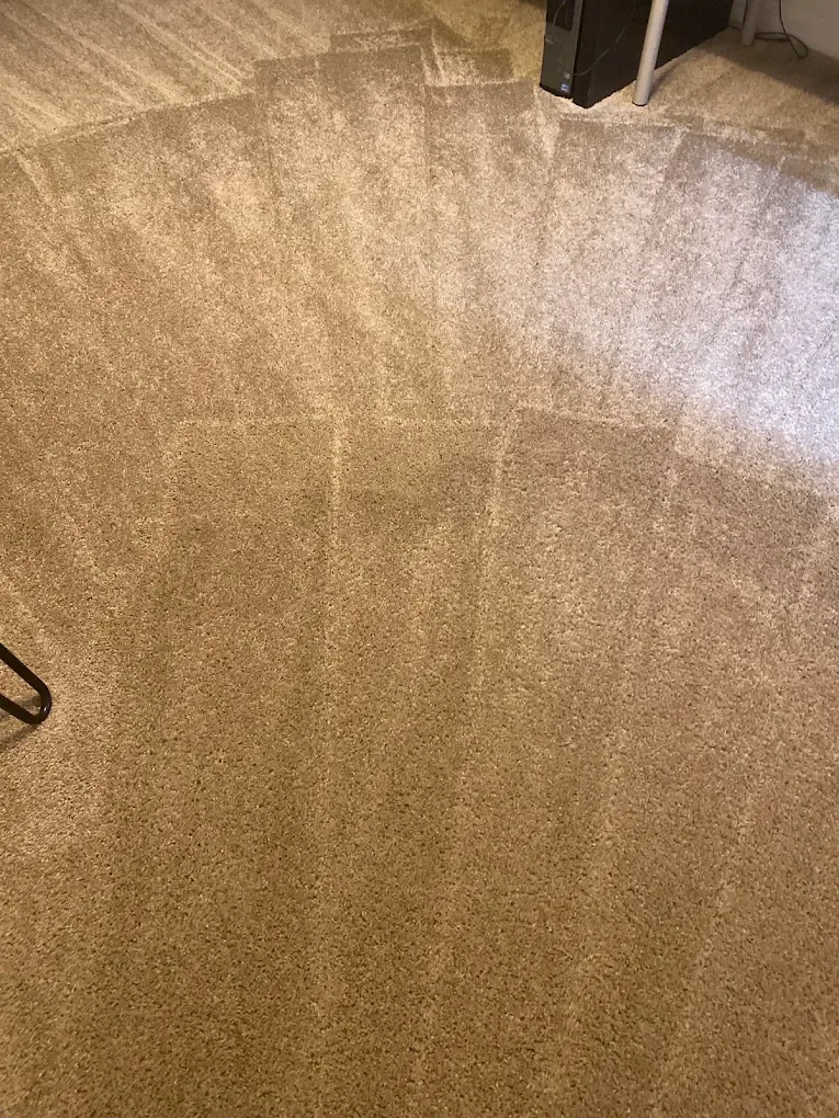 tan carpet fan wand strokes close up desk leg