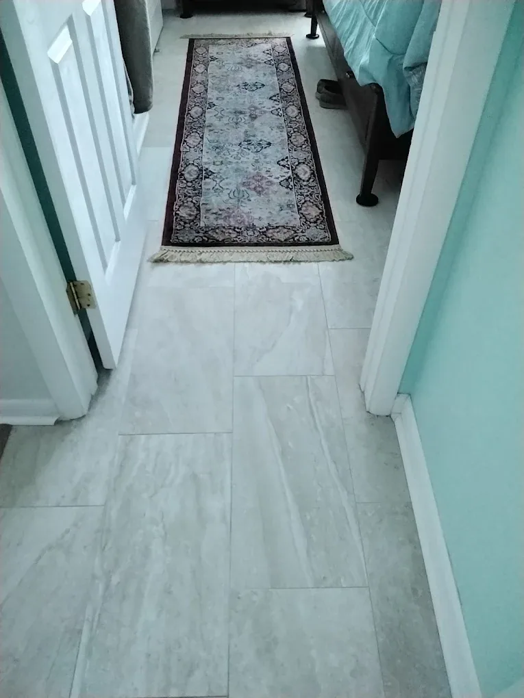 white marble look plank tile oriental runner bedroom doorway